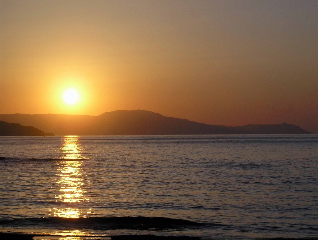 Golden sunset over coastline and ocean
